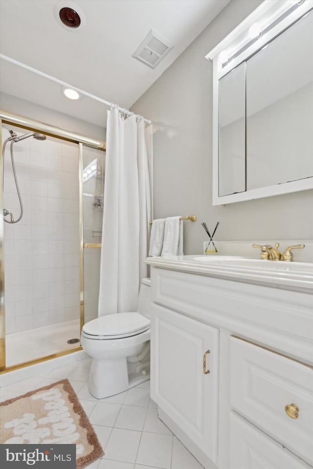 bathroom featuring tile patterned floors, toilet, a shower with curtain, and vanity