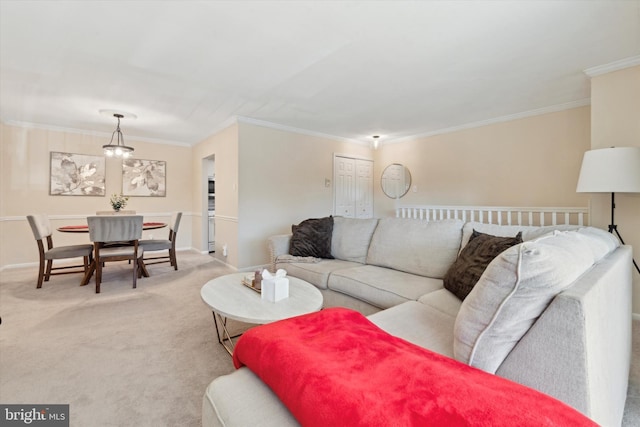 living room featuring light carpet, an inviting chandelier, and ornamental molding