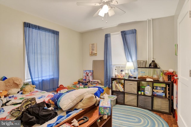 bedroom featuring ceiling fan and hardwood / wood-style flooring