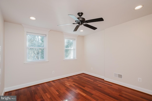 unfurnished room featuring ceiling fan and dark hardwood / wood-style flooring