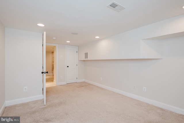 basement with light carpet