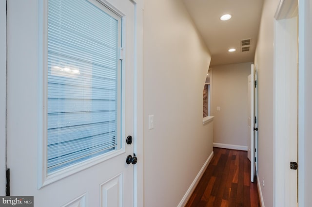 doorway to outside with dark hardwood / wood-style floors