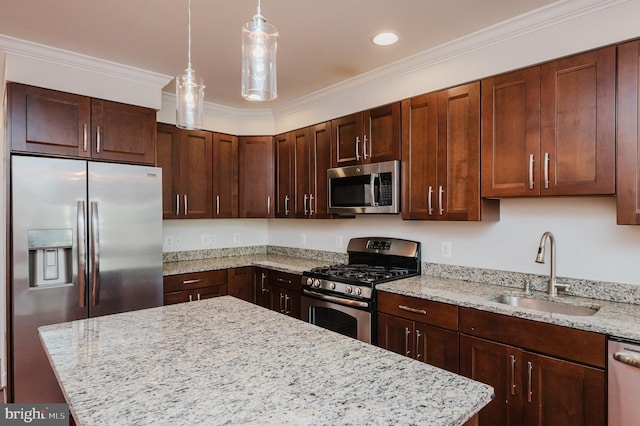 kitchen with sink, light stone countertops, hanging light fixtures, and appliances with stainless steel finishes