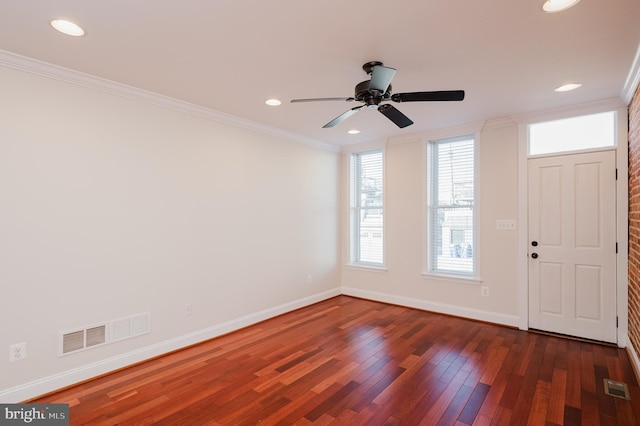 foyer featuring crown molding, ceiling fan, and dark hardwood / wood-style flooring