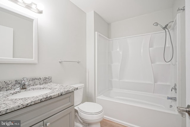 full bathroom with toilet, vanity, and bathing tub / shower combination