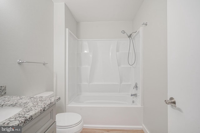 full bathroom featuring toilet, vanity, and bathtub / shower combination