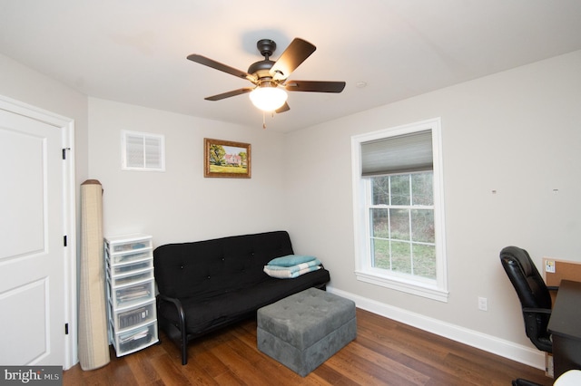 home office with dark hardwood / wood-style floors and ceiling fan