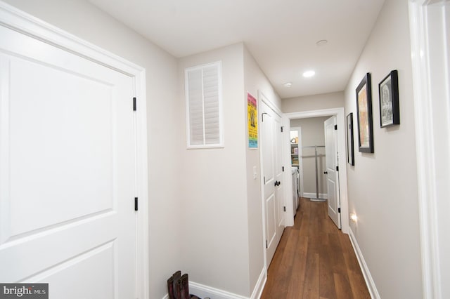 hall with dark hardwood / wood-style flooring