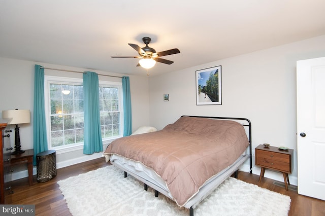 bedroom featuring dark wood-type flooring and ceiling fan