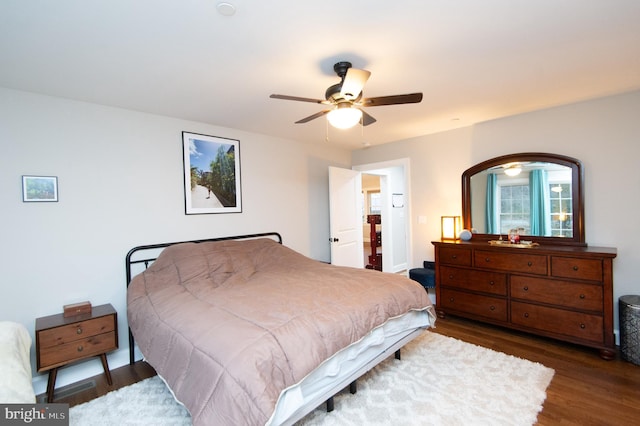 bedroom featuring dark wood-type flooring and ceiling fan