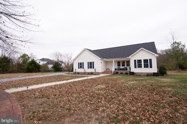 ranch-style house with a porch and a front yard