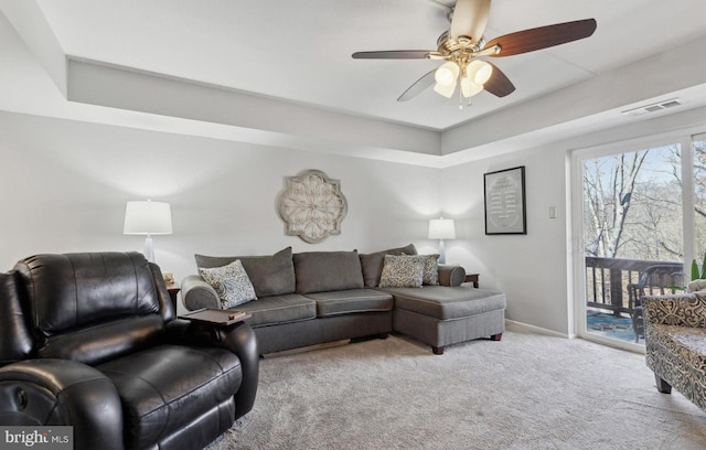 living room with ceiling fan and light colored carpet