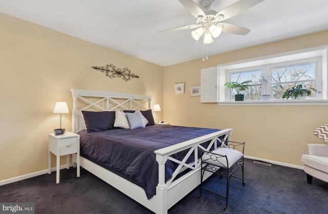 carpeted bedroom with ceiling fan