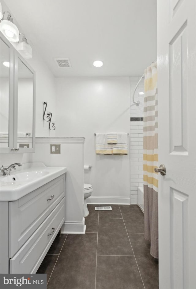 full bathroom featuring toilet, vanity, shower / tub combo with curtain, and tile patterned flooring