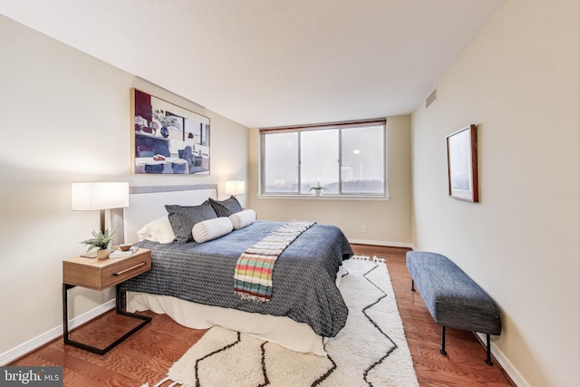 bedroom with wood-type flooring