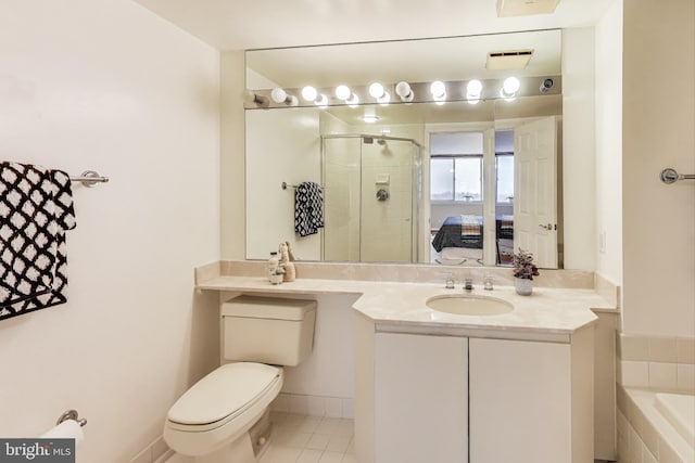 full bathroom with toilet, vanity, tile patterned flooring, and independent shower and bath