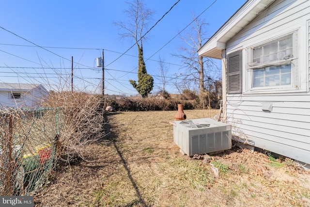 view of yard with central AC unit