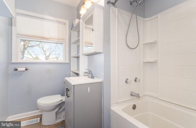 full bathroom featuring vanity, toilet, shower / bathing tub combination, and baseboards