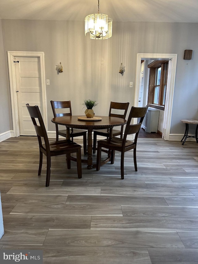 dining space with a notable chandelier