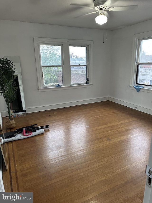 interior space featuring ceiling fan and hardwood / wood-style flooring