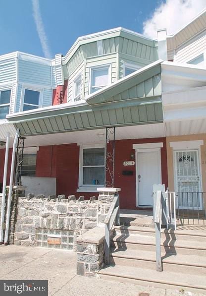 entrance to property with a porch