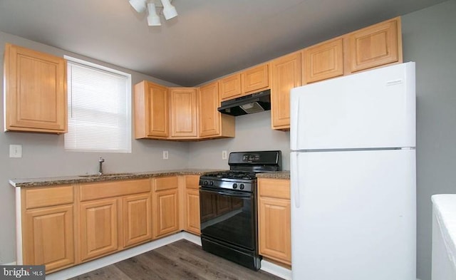 kitchen with white fridge, sink, black gas range oven, light brown cabinetry, and dark hardwood / wood-style flooring