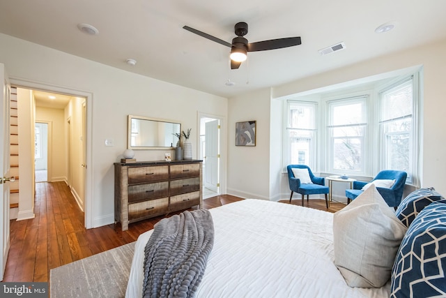 bedroom featuring ceiling fan and dark hardwood / wood-style flooring