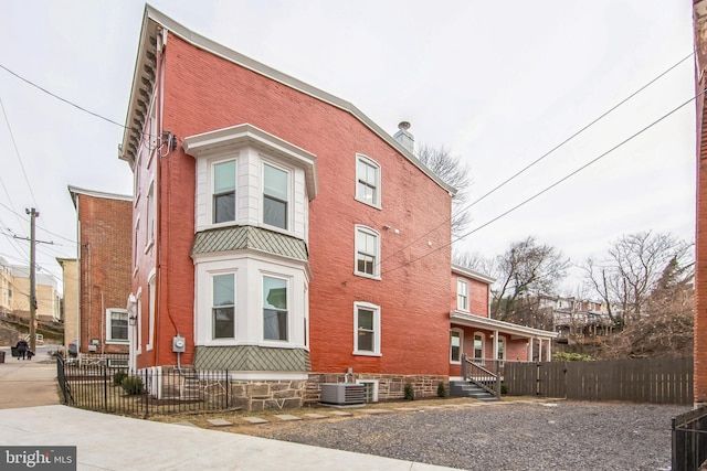 view of side of property featuring central AC unit