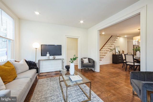 living room featuring parquet floors