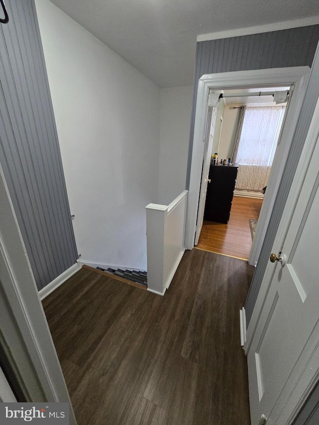 hall with dark hardwood / wood-style flooring