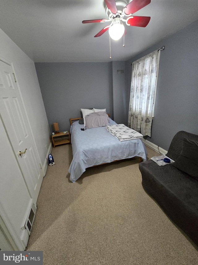 carpeted bedroom featuring ceiling fan