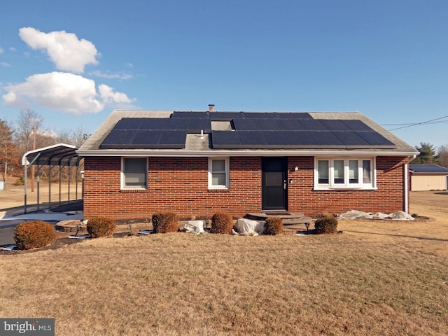 view of front of house with a front lawn and a carport