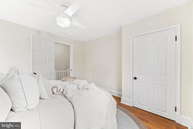 bedroom featuring ceiling fan and wood-type flooring