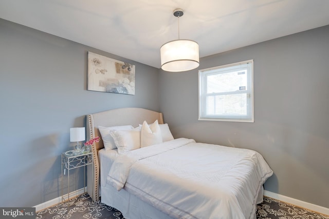 bedroom featuring baseboards