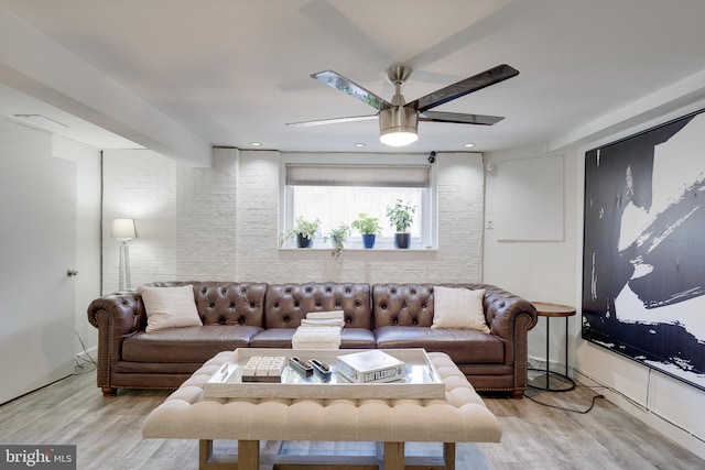 living room featuring ceiling fan and wood finished floors