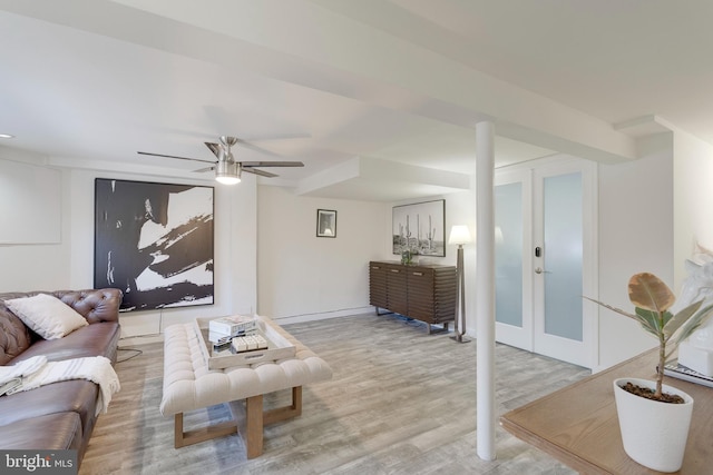 living room with light wood-style floors, french doors, baseboards, and a ceiling fan