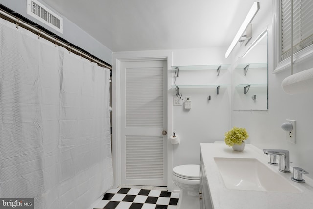 bathroom with toilet, tile patterned floors, vanity, visible vents, and a shower with curtain