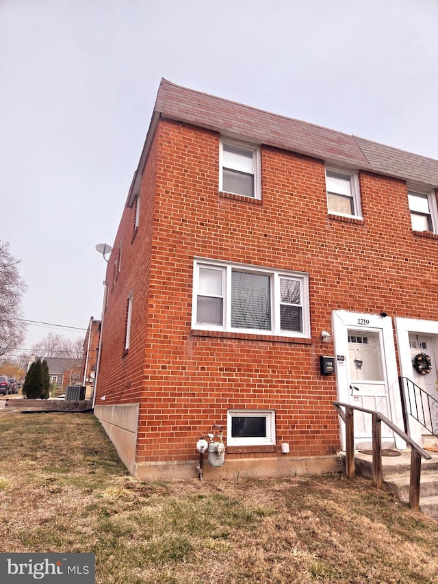 view of property exterior with a yard