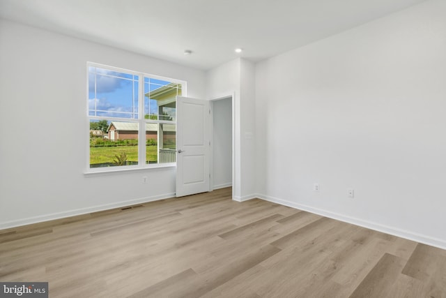 unfurnished room featuring light wood-type flooring