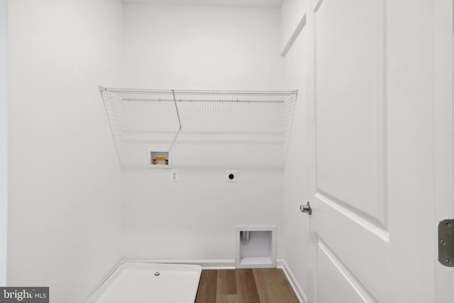 clothes washing area featuring washer hookup, hardwood / wood-style floors, and electric dryer hookup