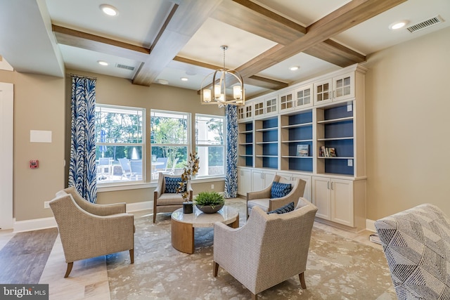 living area featuring built in features, beam ceiling, a notable chandelier, and coffered ceiling