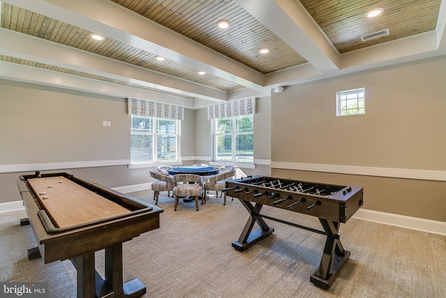 game room featuring wooden ceiling, a healthy amount of sunlight, and beamed ceiling