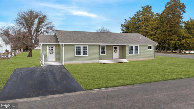 ranch-style home with a front lawn