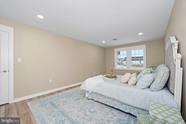 bedroom featuring light hardwood / wood-style floors