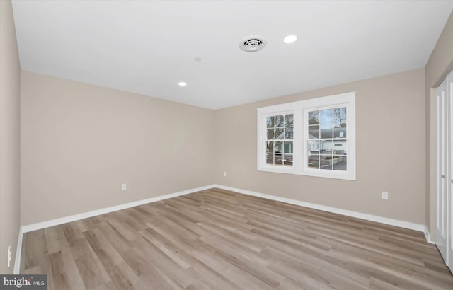 unfurnished bedroom with light wood-type flooring