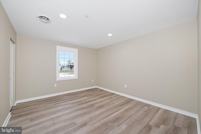 spare room featuring light wood-type flooring