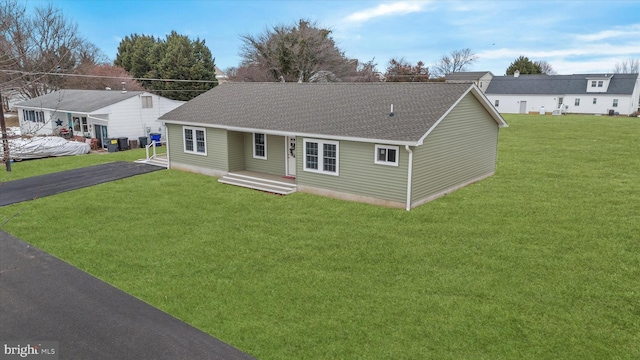 ranch-style house featuring a front yard