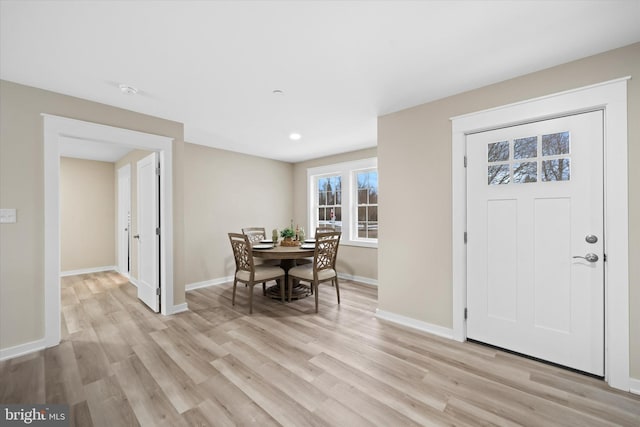 dining space with light hardwood / wood-style floors