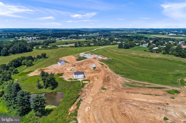 aerial view with a water view and a rural view