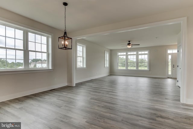 interior space featuring ceiling fan, hardwood / wood-style floors, and plenty of natural light